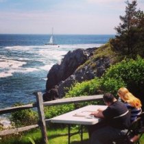 A visitor from the Waban Center enjoys a drawing session at the OMAA