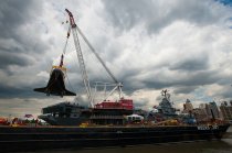 Space shuttle Enterprise is craned onto the flight deck of the Intrepid Sea, Air & Space Museum in New York City on June 6, 2012.